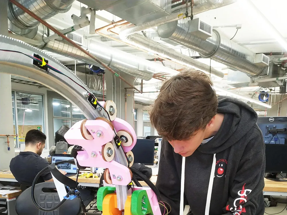 Students working hands-on in a Boston STEAM technology lab